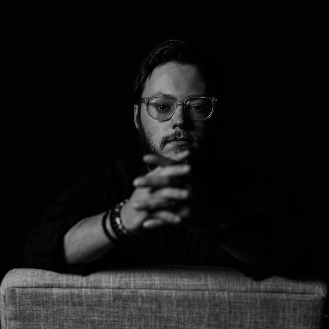 Studio portrait of a European man filmmaker and editor