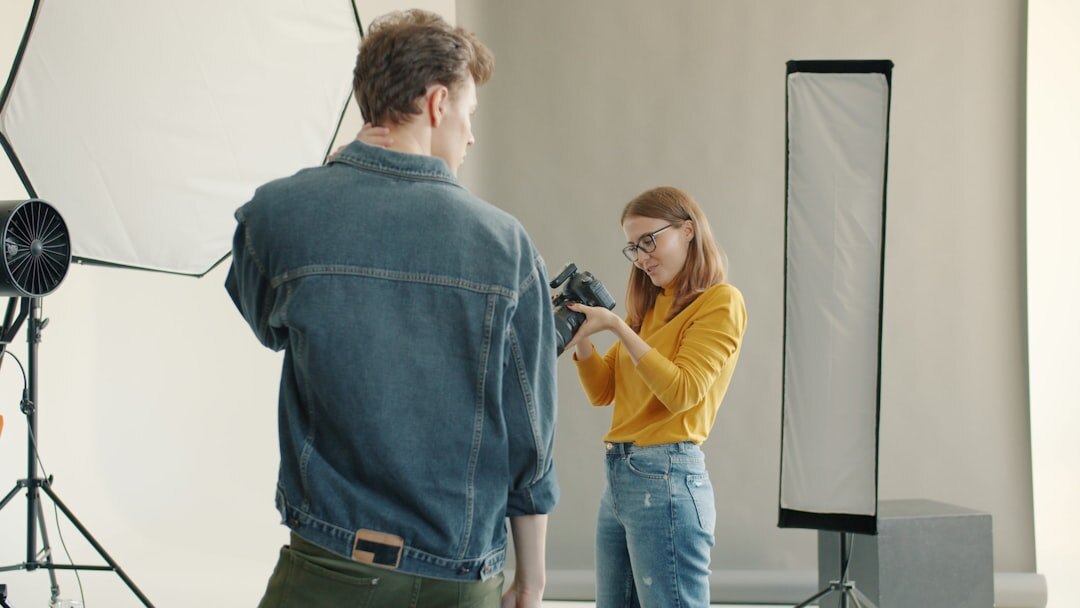 Two-camera documentary interview setup with softbox lighting and microphone